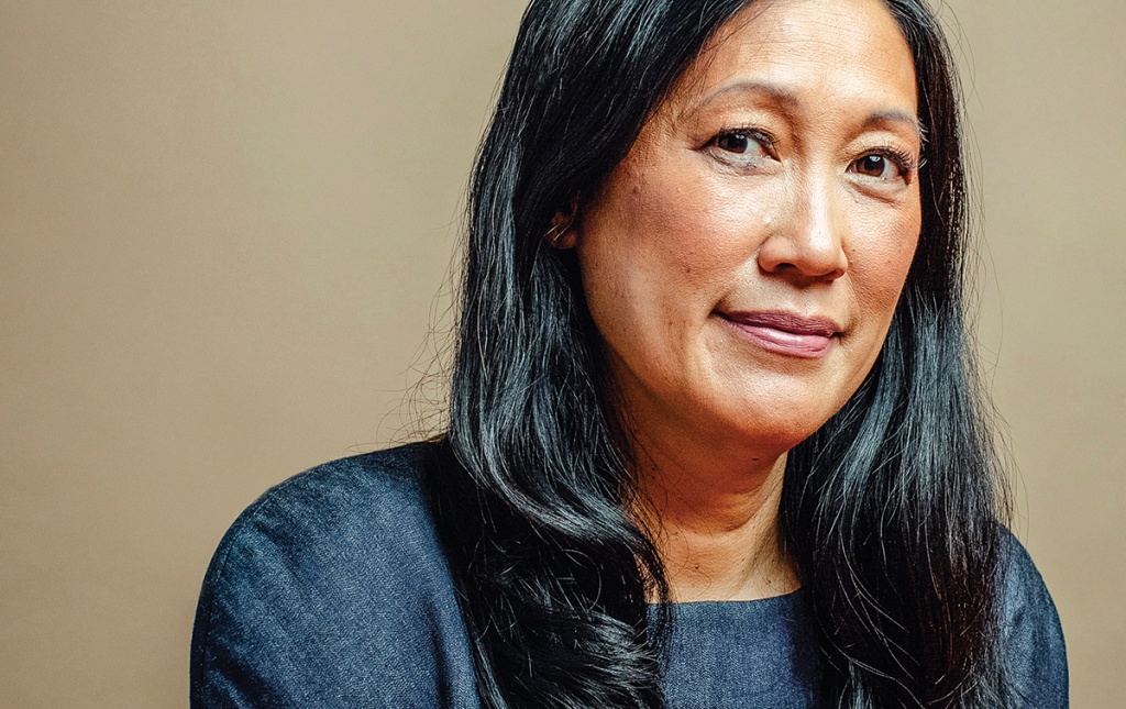 Photograph of ​​​​​​​Theresia Gouw &rsquo;90 at a table